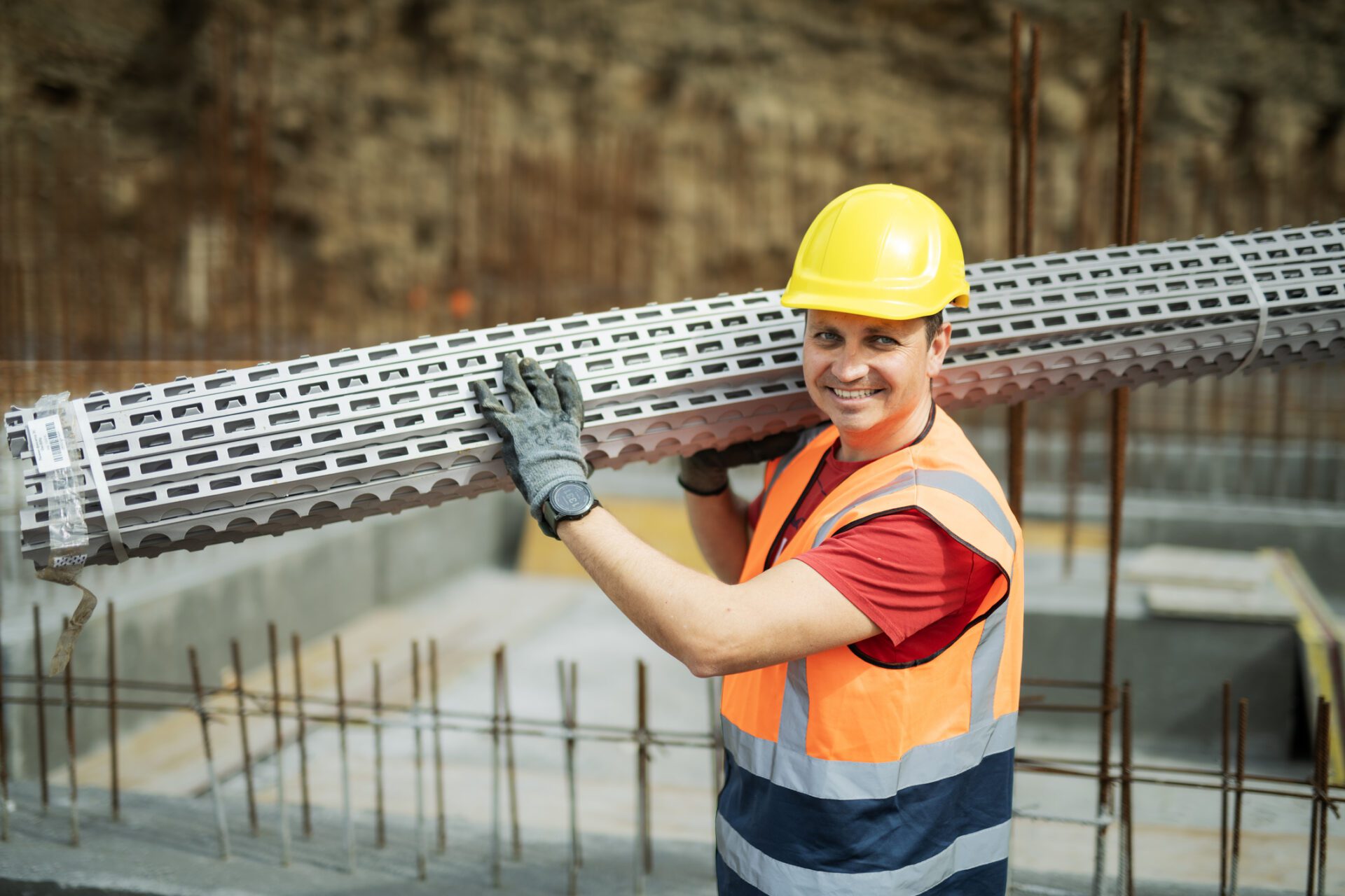 Smiling builder with safety gear